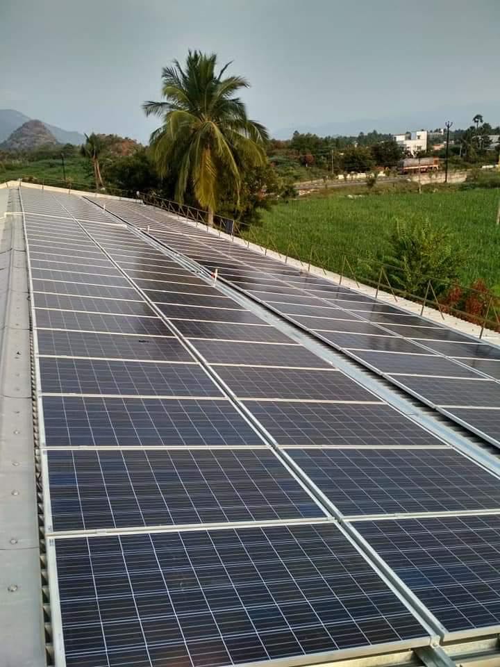 Solar panels installed on a metal-sheet industrial roof